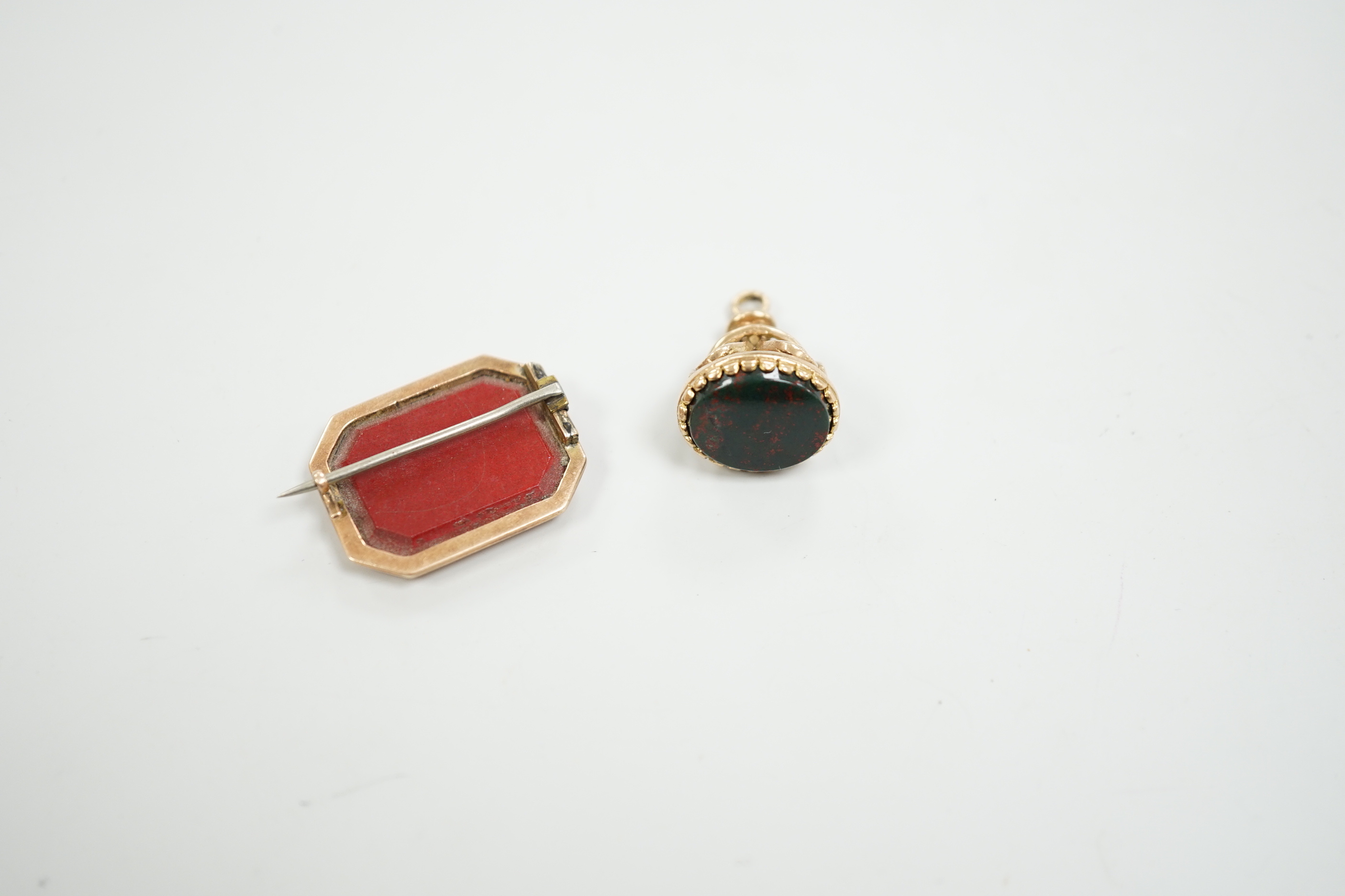 A 19th century yellow metal and micro mosaic set brooch, 23mm and a similar yellow metal overlaid and bloodstone set fob seal.